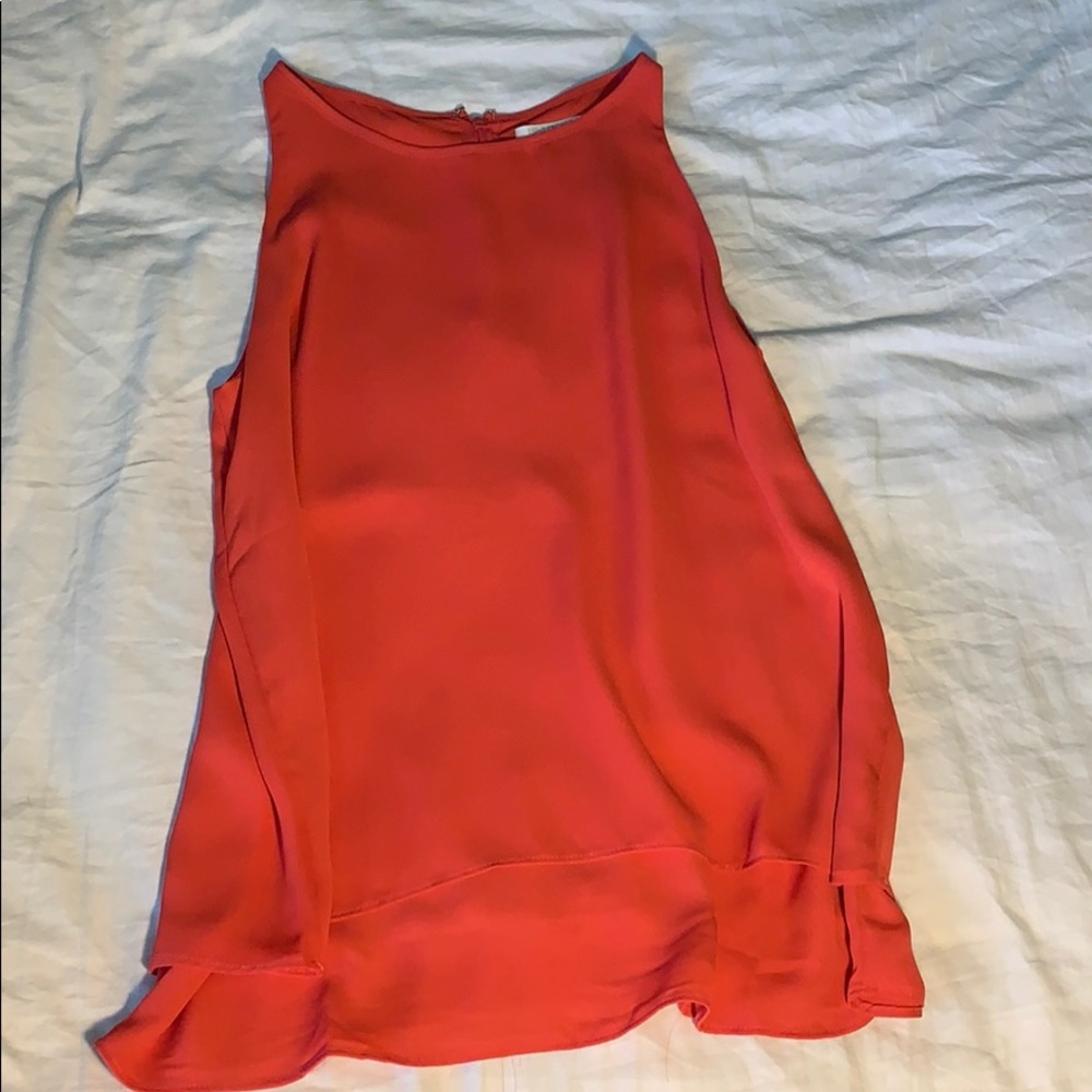Sleeveless coral top.